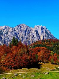 Scenic view of mountains against clear blue sky