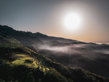 Scenic view of mountains against sky during sunset