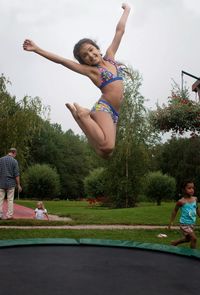 Woman jumping in park