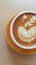 Close-up of cappuccino on table