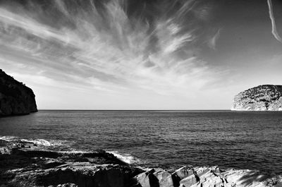 Scenic view of sea against cloudy sky