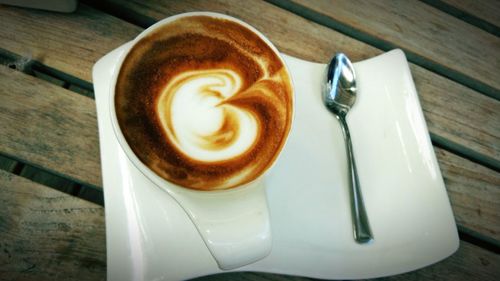 Close-up of cappuccino on table