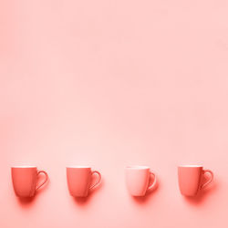 Close-up of wine glasses against white background