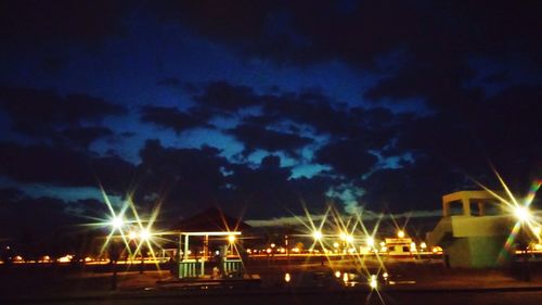 View of illuminated street light against sky