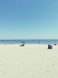 Scenic view of beach against clear sky