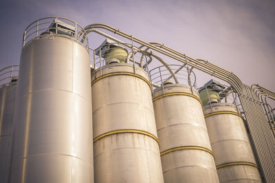 Low angle view of storage tanks