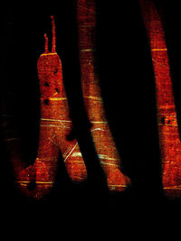 Close-up of illuminated christmas lights against wall