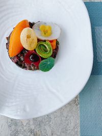 High angle view of fruits in plate on table