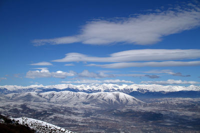 Scenic view of snowcapped mountains against sky