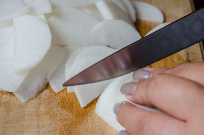 Close-up of hand holding ice cream
