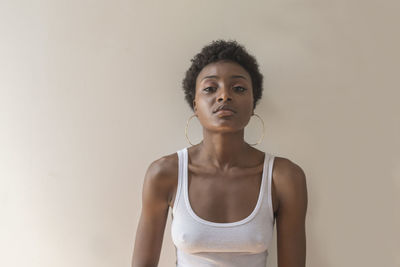 Portrait of a young woman with hoop earrings