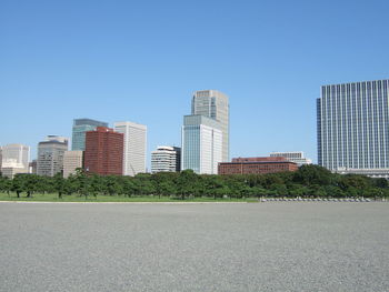 Surface level of modern buildings against clear blue sky