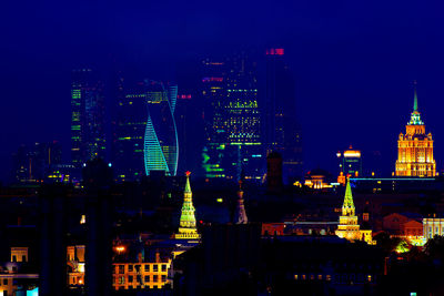 Illuminated buildings in city at night