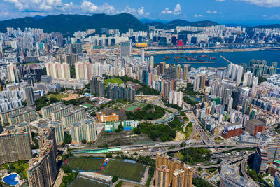 High angle view of modern buildings in city against sky