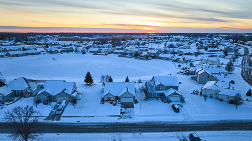 High angle view of people at beach during sunset