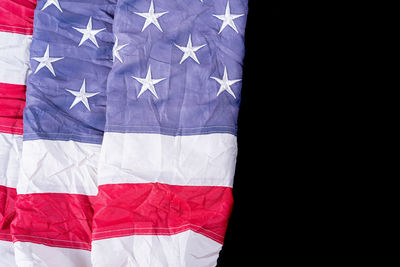 Close-up of flag against black background