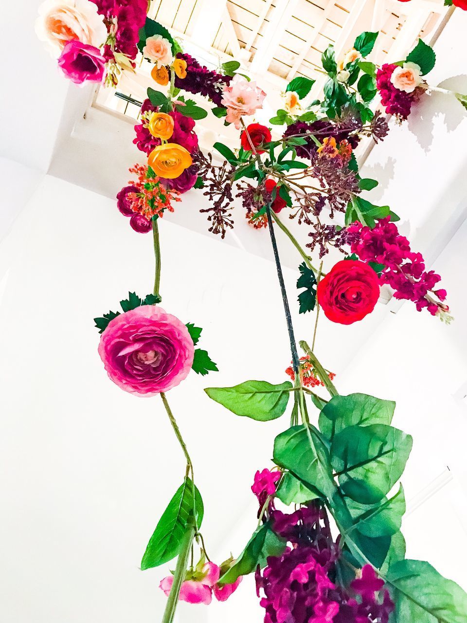 CLOSE-UP OF PINK ROSE FLOWER VASE