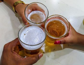 High angle view of woman holding drink