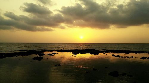 Scenic view of sea at sunset