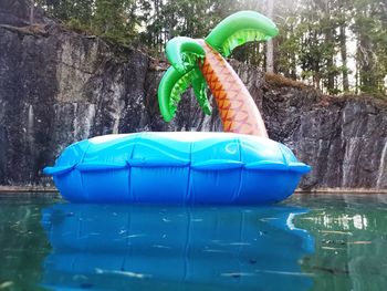 Blue toy car in swimming pool