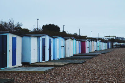 Scenic view of beach huts against clear sky