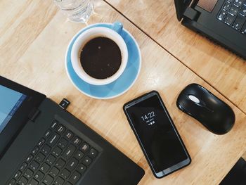 High angle view of coffee cup on table