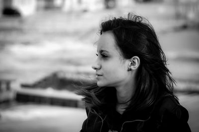 Close-up of teenage girl looking away