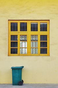 Yellow windows on wall of building