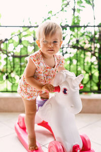 Cute girl with toy