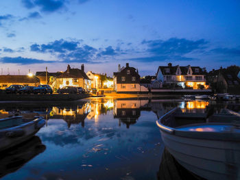 Reflection of buildings in water at harbour 