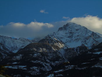 Scenic view of snowcapped mountains against sky