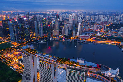 High angle view of illuminated city buildings at night