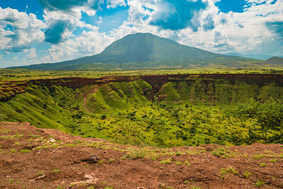 Shimo la mungu - pit of god, makonde plateau with mount ol doinyo lengai in the background, tanzania
