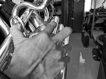 Close-up of hand holding metal