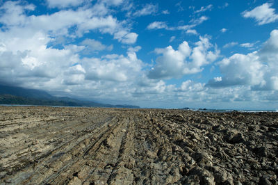 Scenic view of barren landscape against sky