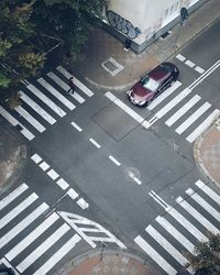 High angle view of woman crossing road