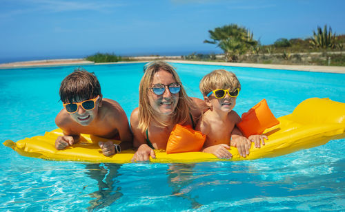 Portrait of woman swimming in pool