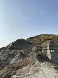 Low angle view of rock formations against sky
