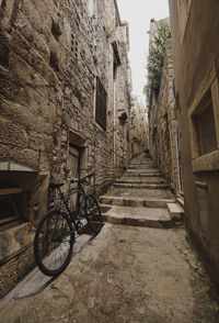 View of narrow alley amidst old building