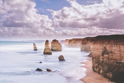 Scenic view of sea against cloudy sky