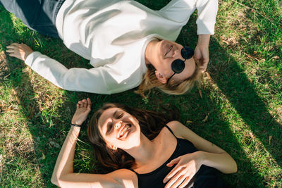 Portrait of young woman sitting on grass