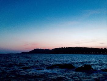 Scenic view of sea against sky at sunset