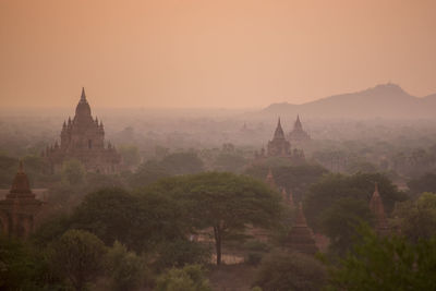 Old ruins of temples against clear sky