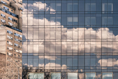 Reflection of buildings on glass window