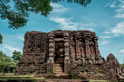 Low angle view of old temple against sky