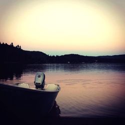 Scenic shot of calm lake at sunset