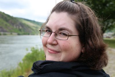 Close-up portrait of mid adult woman wearing eyeglasses