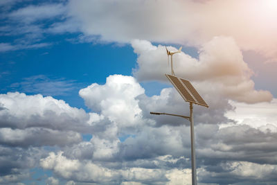 Low angle view of crane against sky