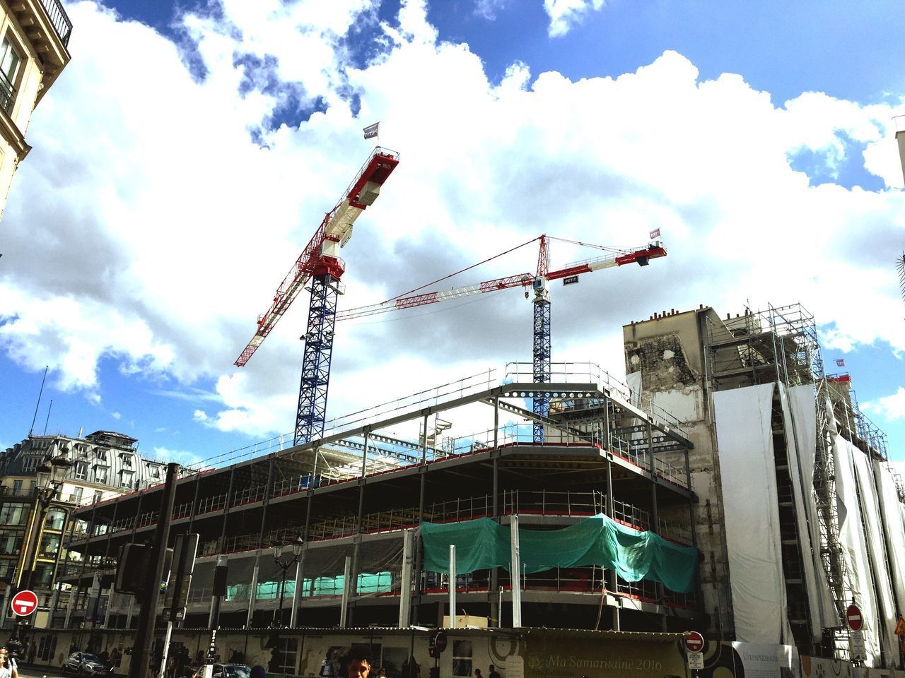 LOW ANGLE VIEW OF CRANE AGAINST SKY