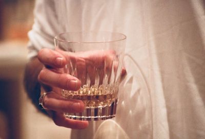 Close-up of hand holding wine glass